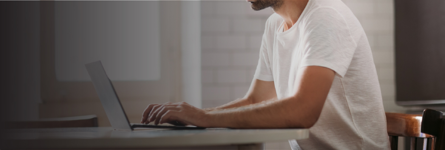 image of man working on a laptop